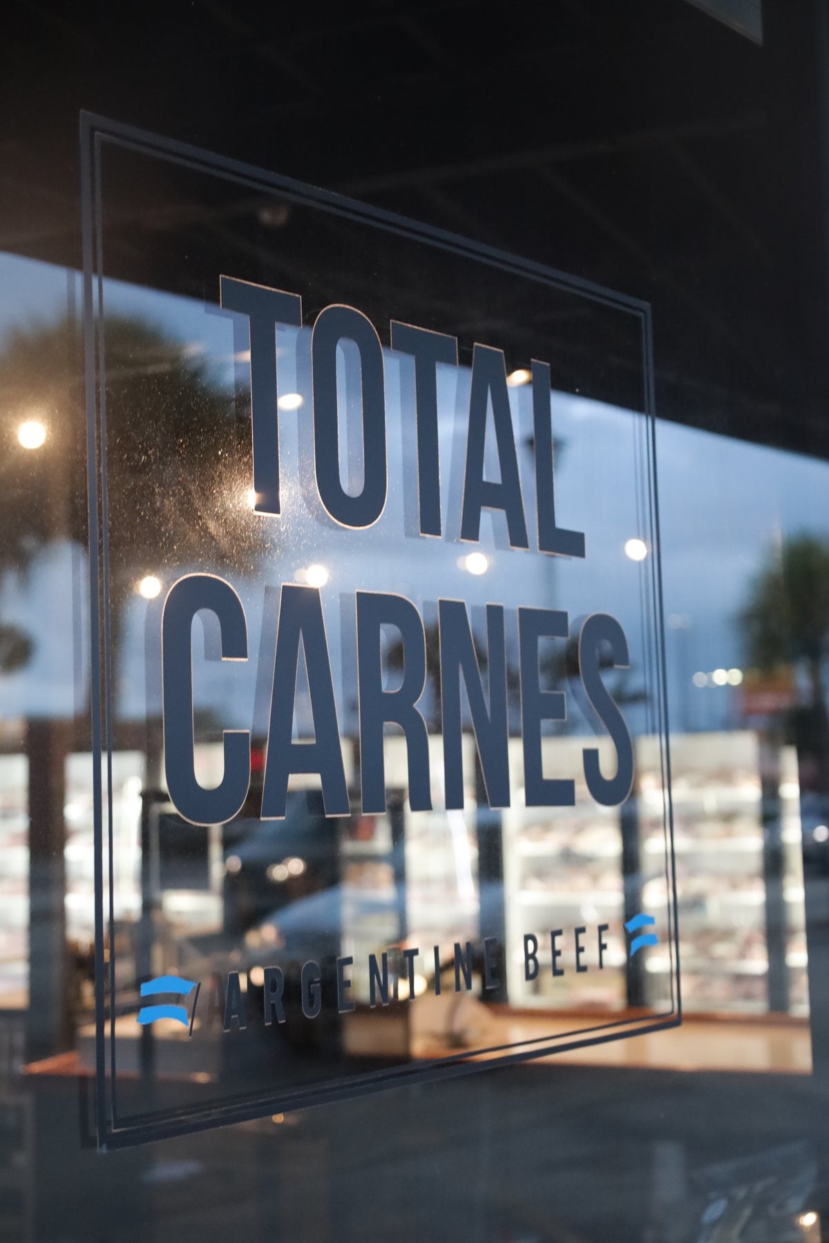 Total Carnes window branding